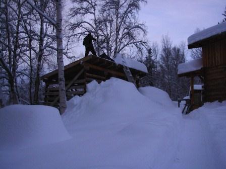 Pete Shoveling Wood Shed Roof