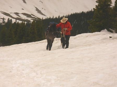 Crossing snow field on Cumberland Pass